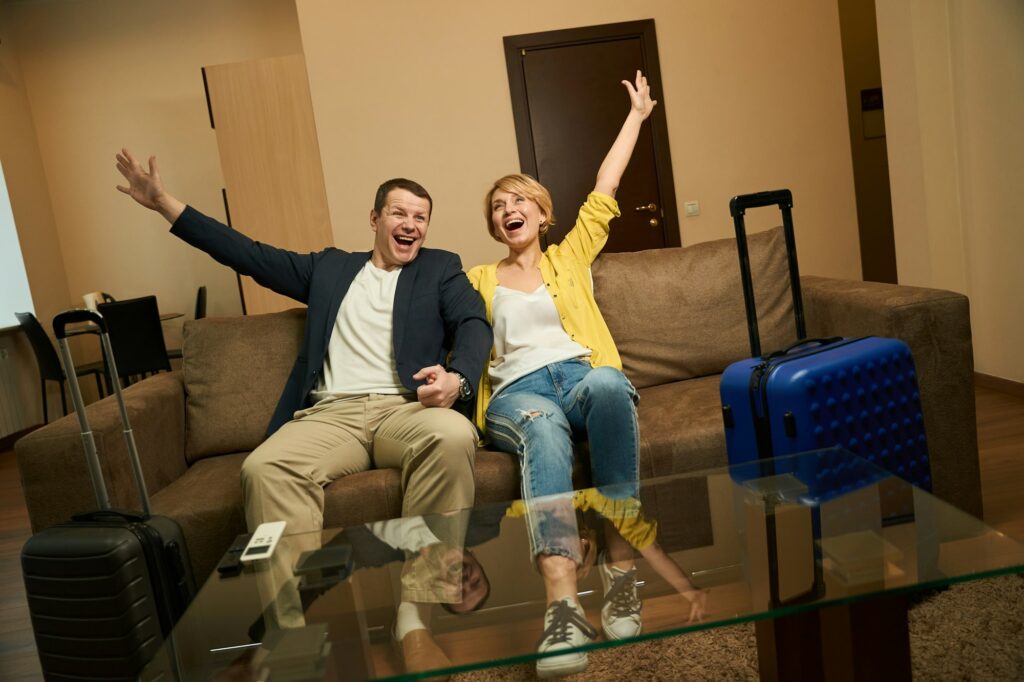 Joyful spouses settled in a modern comfortable hotel