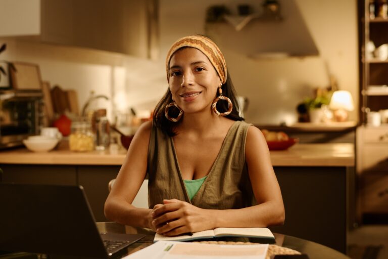 Happy young Latino female freelancer